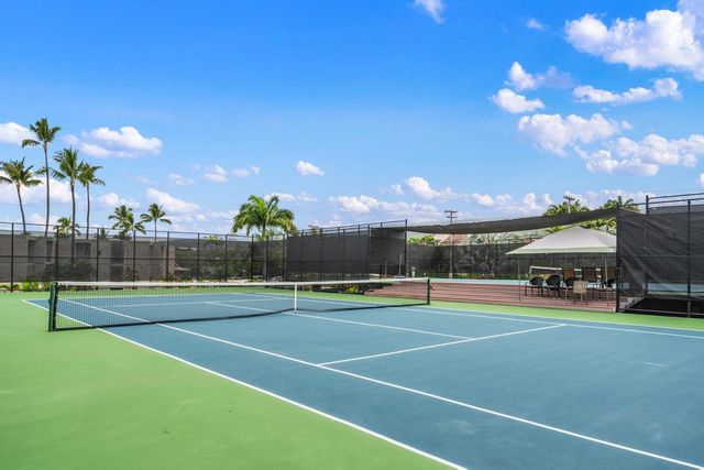 a building view with swimming pool and outdoor space