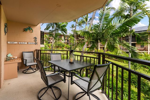 a view of a chairs and table in patio