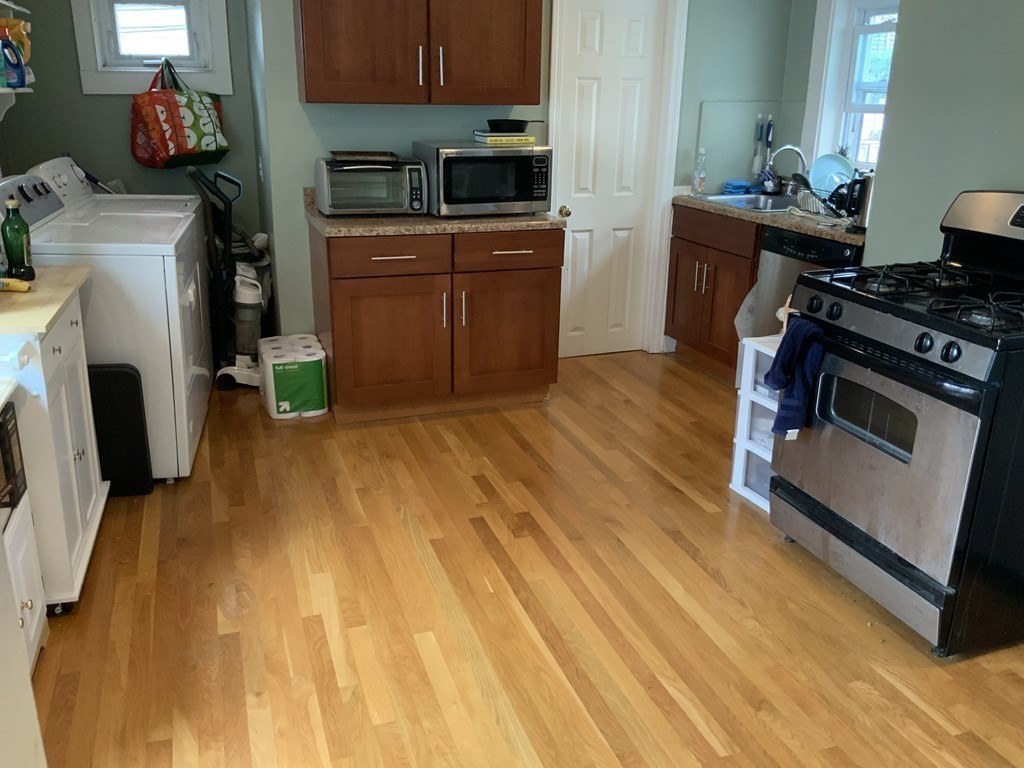 27 Jenkins Street Boston, MA 02127 - Photo 17 of 23 a kitchen with a sink appliances and cabinets