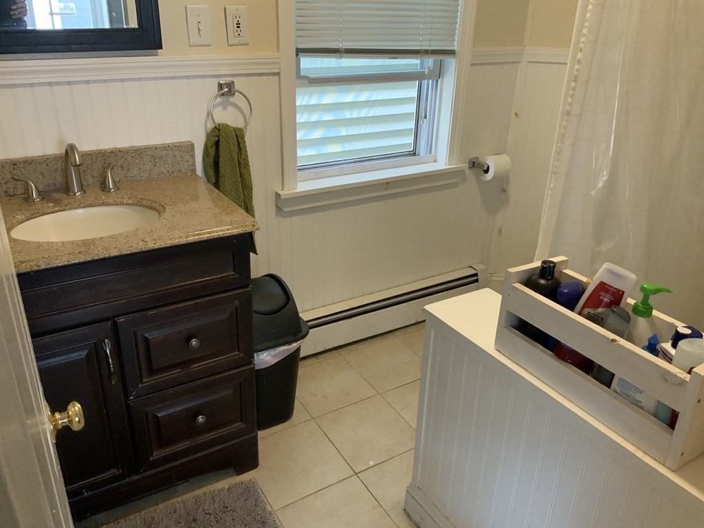 27 Jenkins Street Boston, MA 02127 - Photo 19 of 23 a bathroom with a sink and a mirror