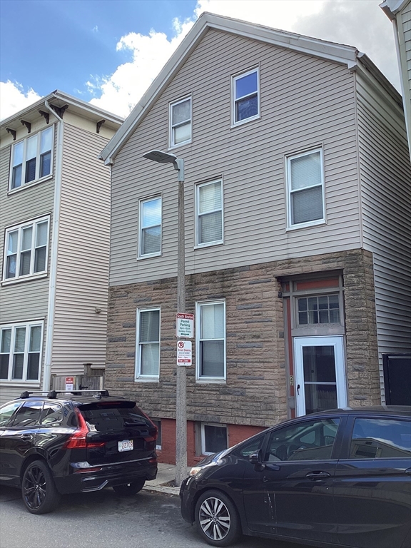 27 Jenkins Street Boston, MA 02127 - Photo 2 of 23 a car parked in front of a house