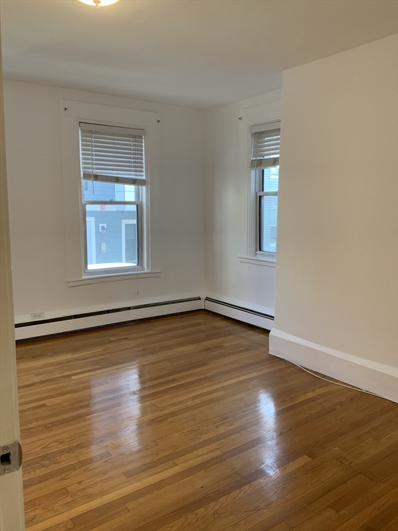 27 Jenkins Street Boston, MA 02127 - Photo 6 of 23 a view of a room with wooden floor and window