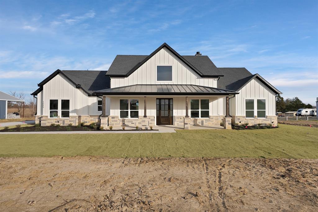 3089 County Road 1076 Celeste, TX 75423 - Photo 2 of 39 a front view of a house with garden