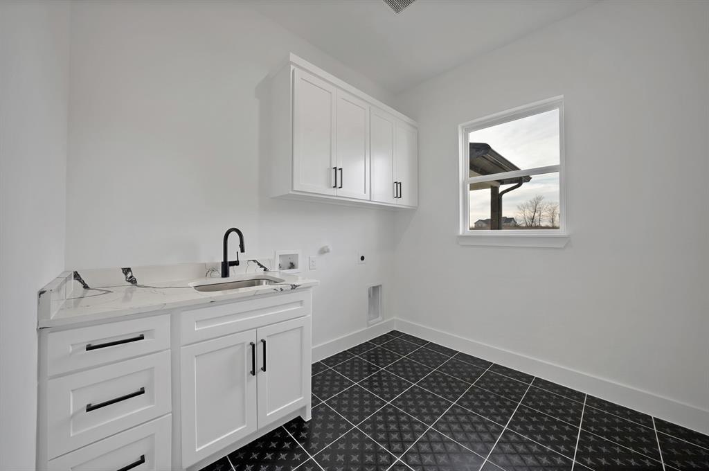 3089 County Road 1076 Celeste, TX 75423 - Photo 22 of 39 a kitchen with a sink and cabinets