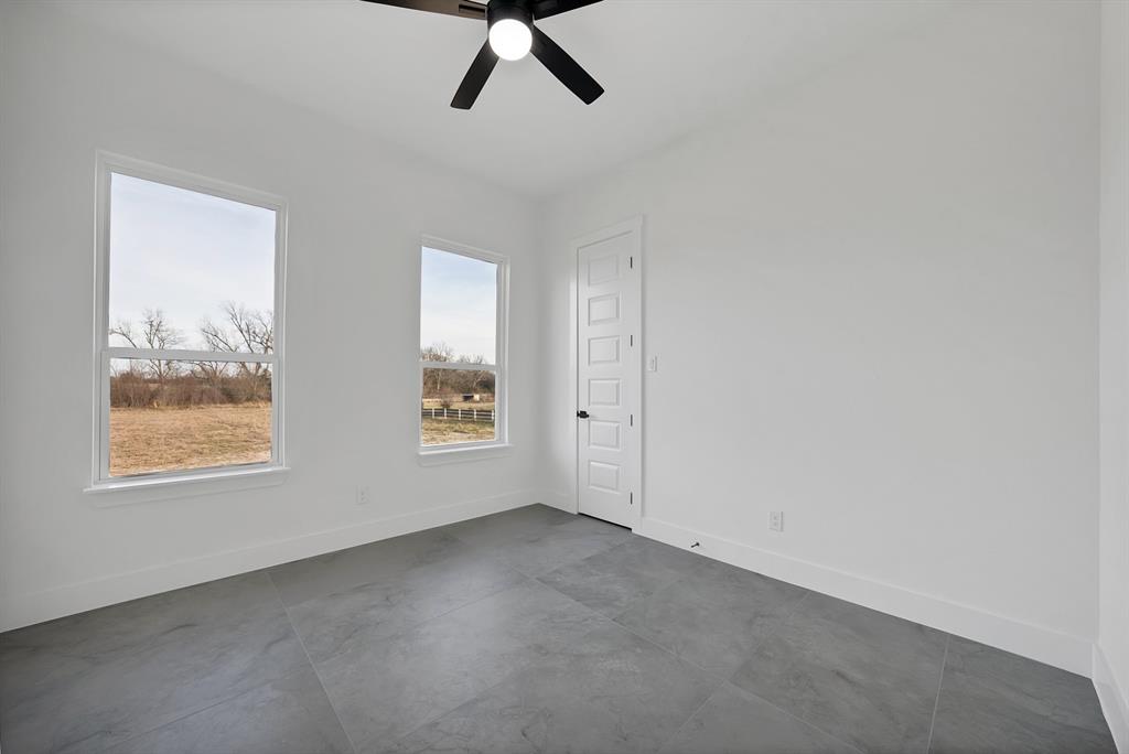3089 County Road 1076 Celeste, TX 75423 - Photo 28 of 39 an empty room with a window