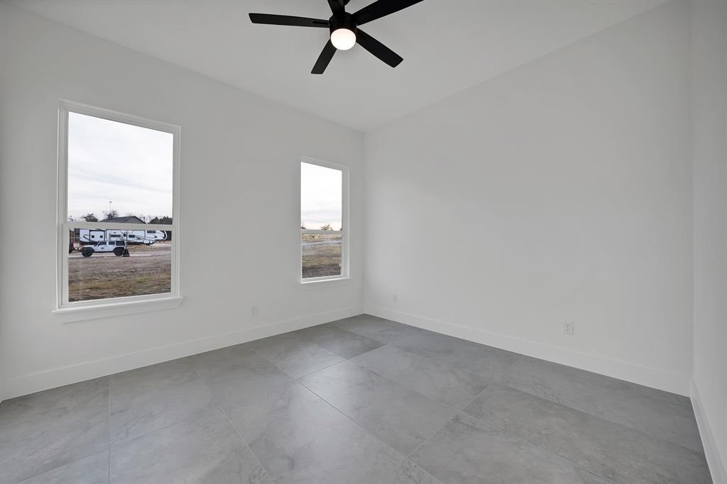 3089 County Road 1076 Celeste, TX 75423 - Photo 30 of 39 an empty room with a window