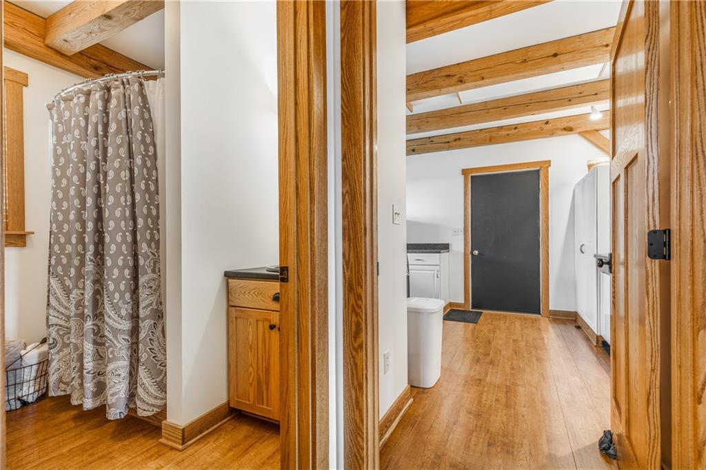 298 Laird's Crossing Road Worthington, PA 16262 - Photo 16 of 25 a view of a hallway with wooden floor and staircase