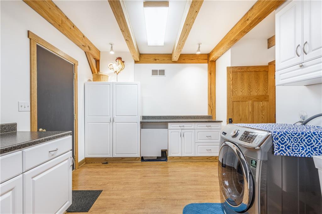 298 Laird's Crossing Road Worthington, PA 16262 - Photo 17 of 25 a view of a kitchen with fridge and wooden floor