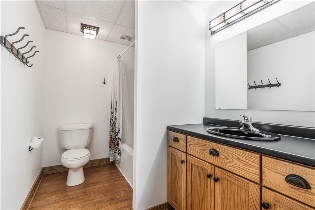 298 Laird's Crossing Road Worthington, PA 16262 - Photo 19 of 25 a bathroom with a granite countertop sink a toilet and a mirror