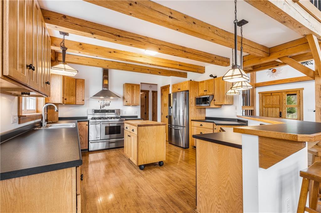298 Laird's Crossing Road Worthington, PA 16262 - Photo 6 of 25 a kitchen with a stove a sink and a refrigerator