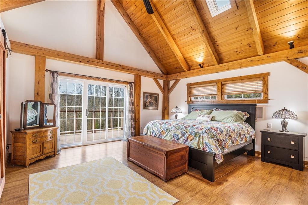 298 Laird's Crossing Road Worthington, PA 16262 - Photo 9 of 25 a bedroom with a bed and wooden floor