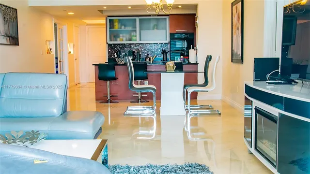 a kitchen with stainless steel appliances granite countertop a sink and cabinets