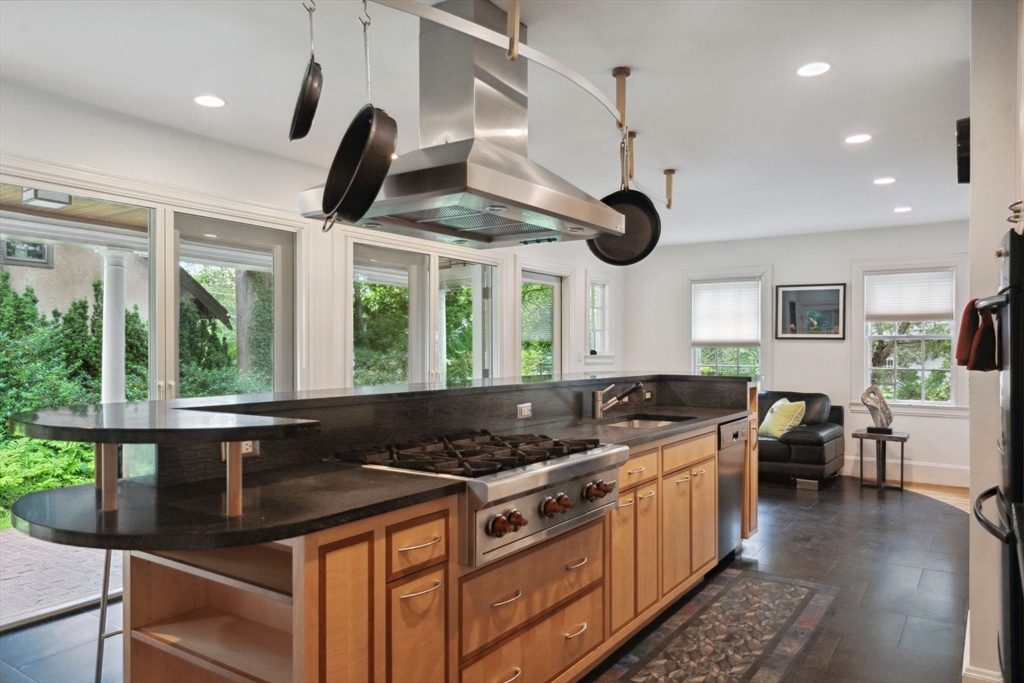 172 Bellevue Road Watertown, MA 02472 - Photo 14 of 34 a kitchen with stainless steel appliances granite countertop a stove and a sink