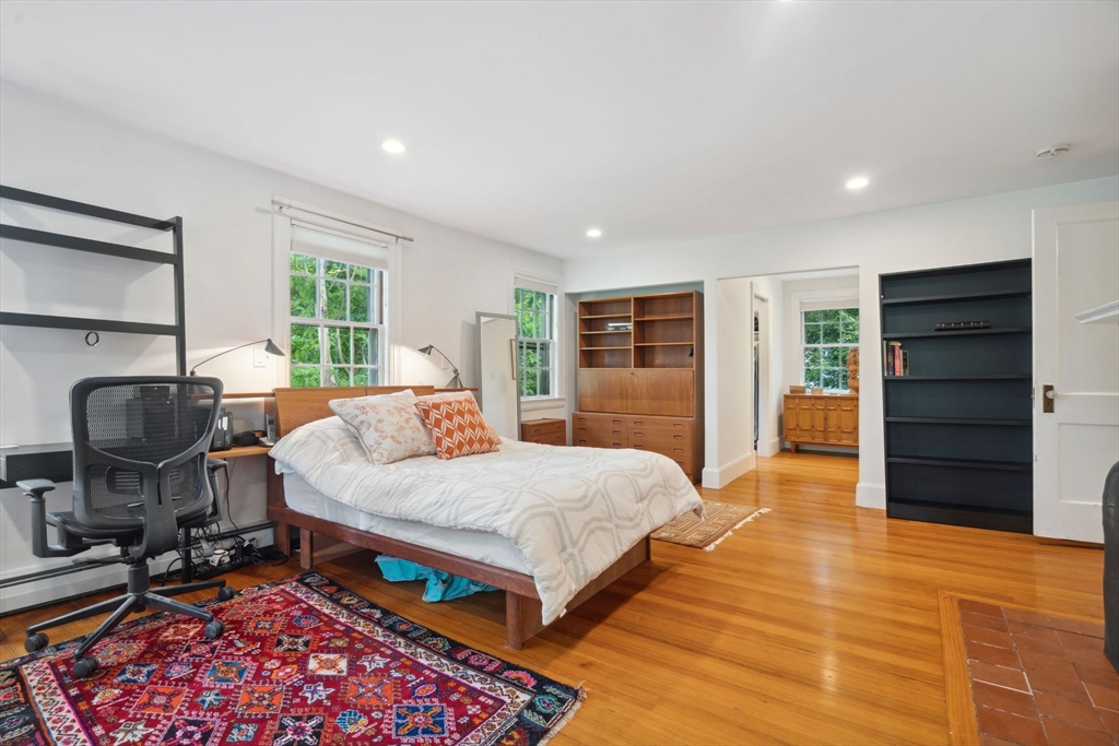 172 Bellevue Road Watertown, MA 02472 - Photo 16 of 34 a bedroom with a bed a table and chair