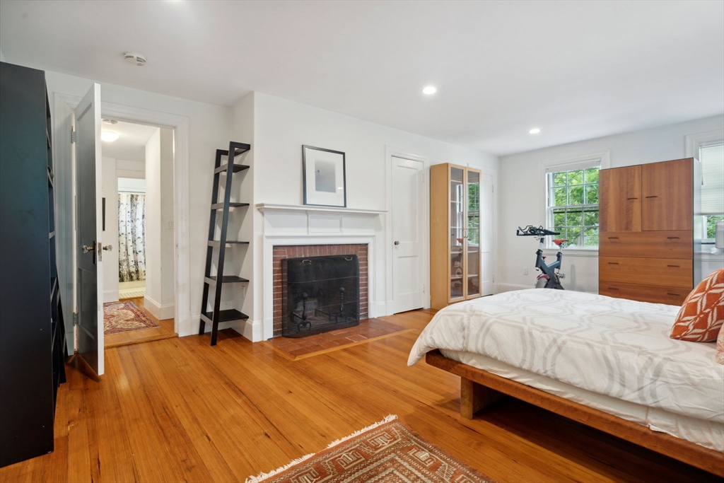 172 Bellevue Road Watertown, MA 02472 - Photo 17 of 34 a bedroom with a bed and a fireplace