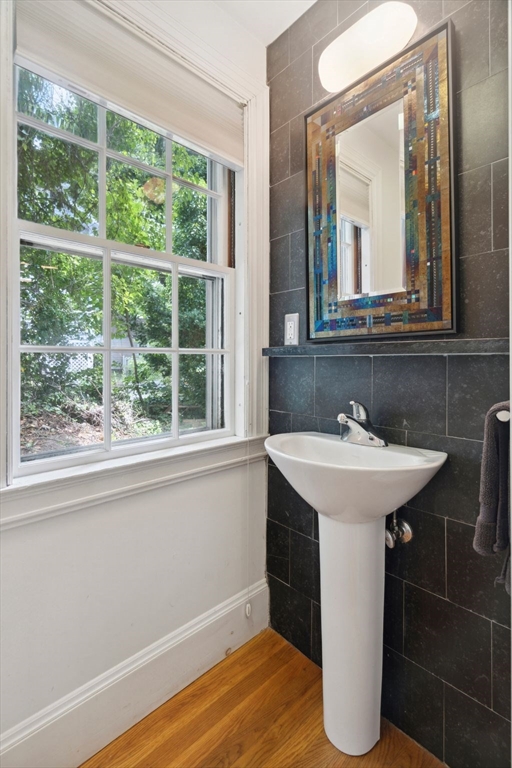 172 Bellevue Road Watertown, MA 02472 - Photo 27 of 34 a bathroom with a sink a mirror and a window