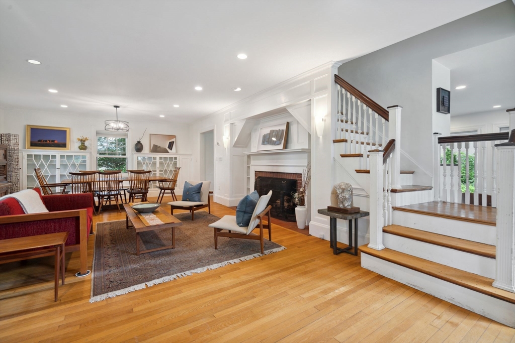 172 Bellevue Road Watertown, MA 02472 - Photo 4 of 34 a living room with fireplace furniture and a wooden floor