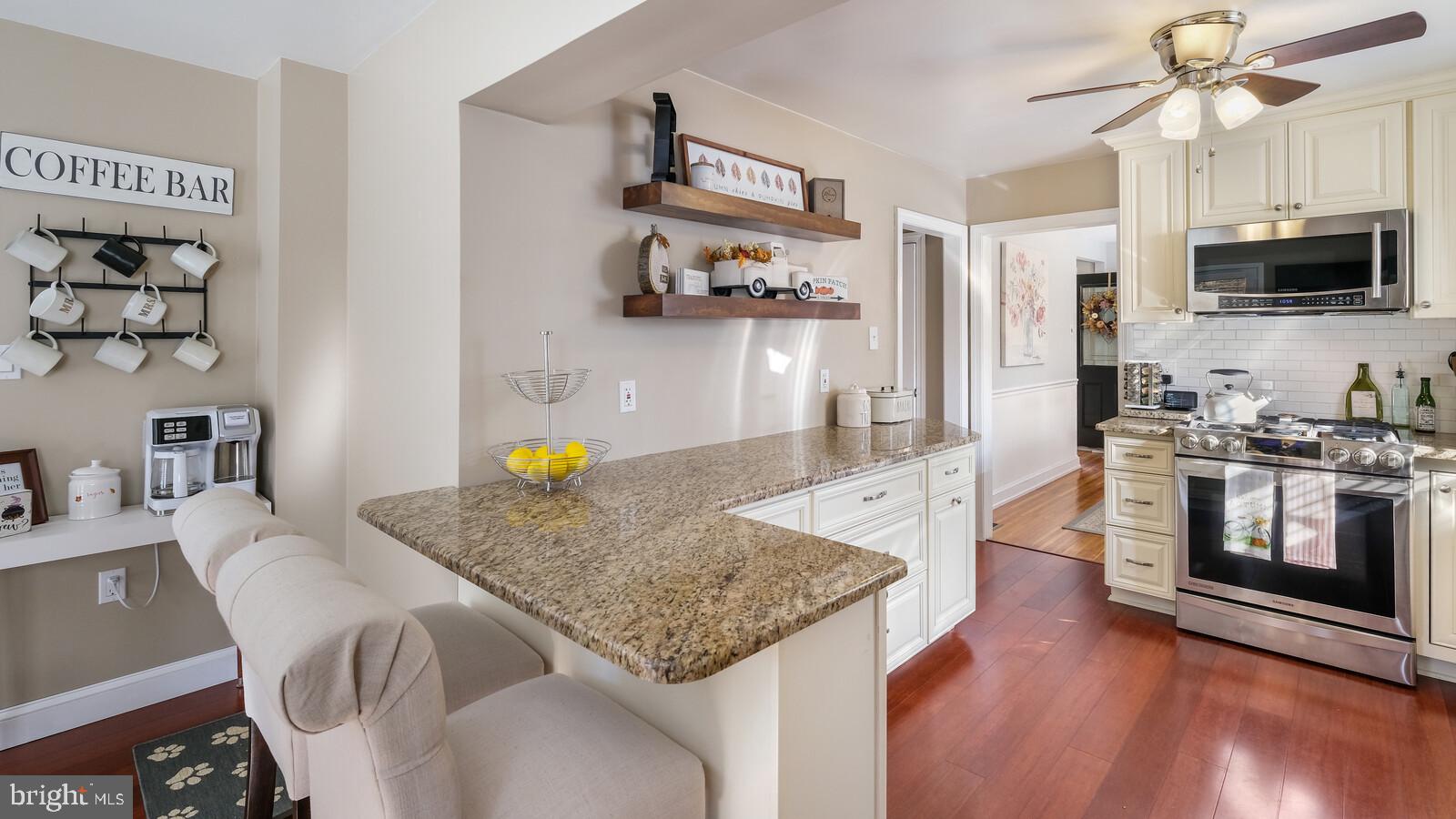 360 Lynn Road Springfield, PA 19064 - Photo 14 of 41 a kitchen with stainless steel appliances granite countertop a sink and a microwave