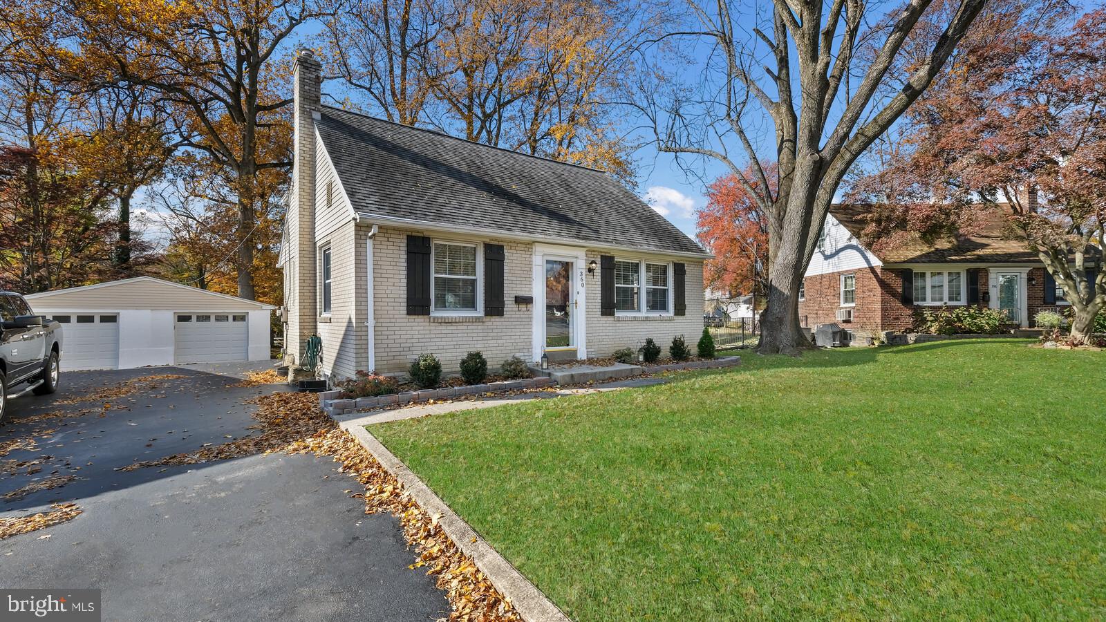 360 Lynn Road Springfield, PA 19064 - Photo 3 of 41 a front view of house with yard and green space
