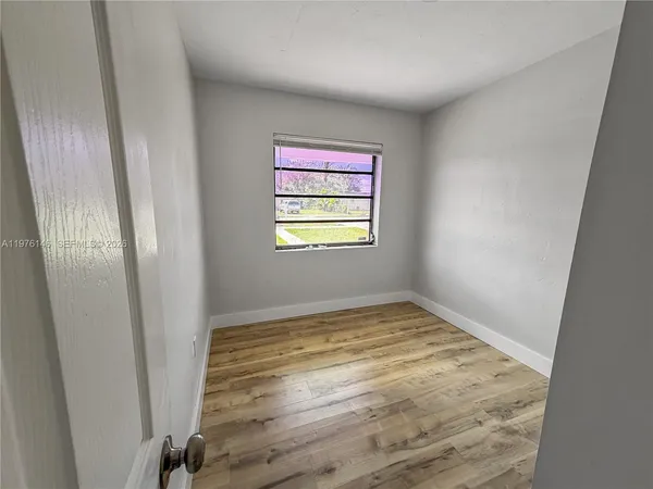 a view of an empty room and window
