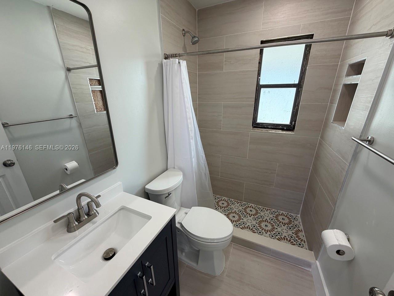 5245 Southwest 98th Court Miami, FL 33165 - Photo 14 of 22 a bathroom with a sink a toilet and shower