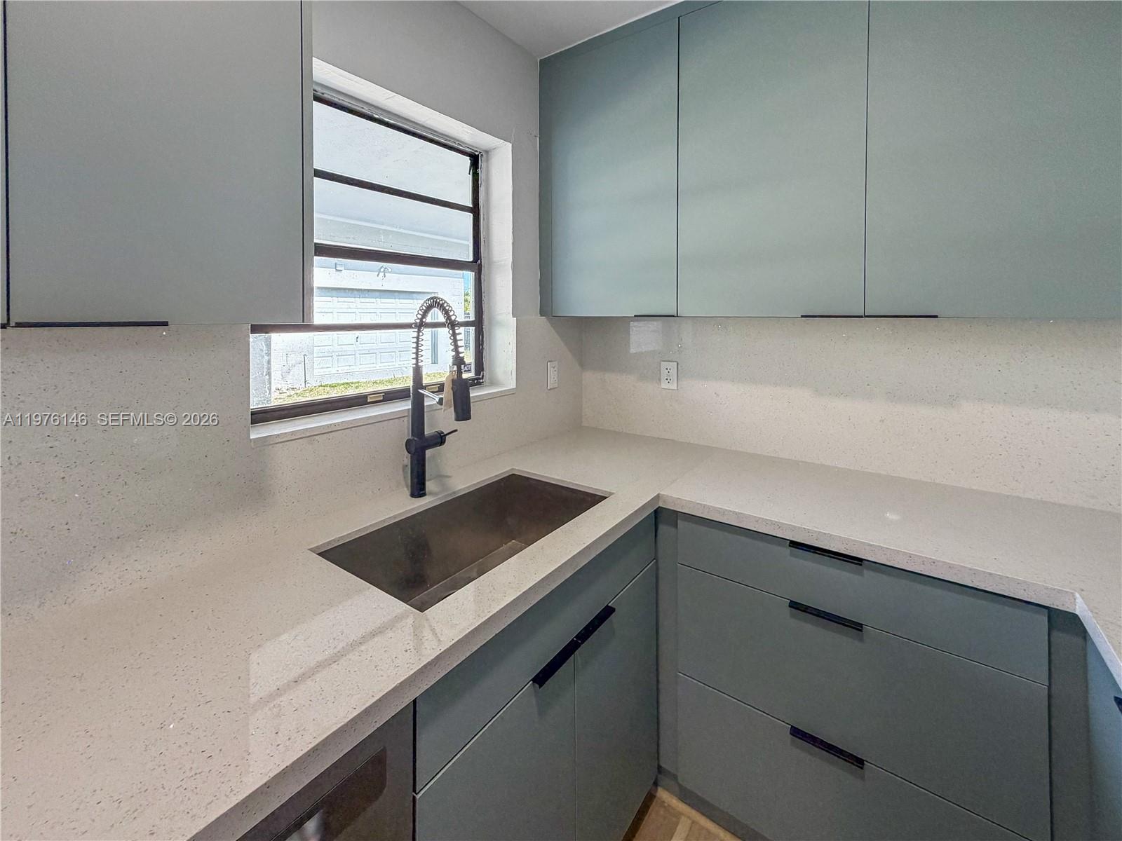 5245 Southwest 98th Court Miami, FL 33165 - Photo 3 of 22 a kitchen with a sink cabinets and window