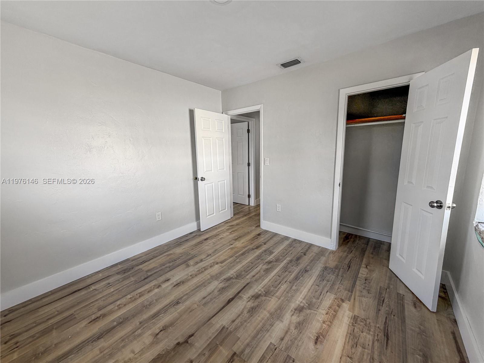 5245 Southwest 98th Court Miami, FL 33165 - Photo 10 of 22 a view of an empty room with closet and a window
