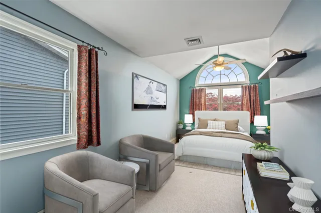 a bedroom with furniture and a window