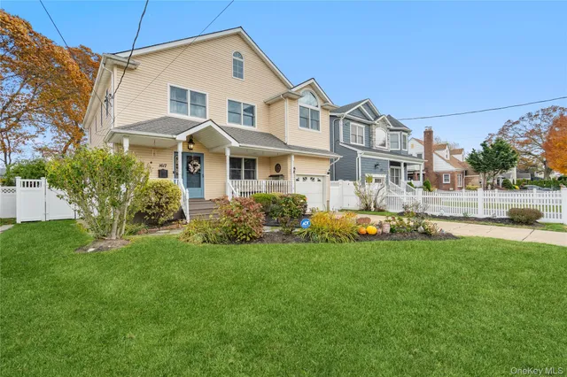 a front view of a house with a garden and plants