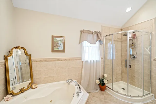 a bathroom with a tub and a shower