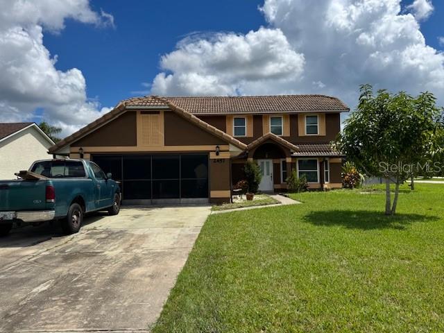 2457 Ravendale Court Kissimmee, FL 34758 - Photo 1 of 17 a front view of a house with a yard