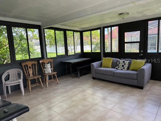 2457 Ravendale Court Kissimmee, FL 34758 - Photo 3 of 17 a living room with furniture and a floor to ceiling window