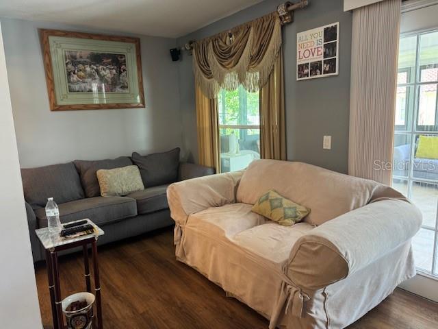 2457 Ravendale Court Kissimmee, FL 34758 - Photo 6 of 17 a living room with furniture and a window