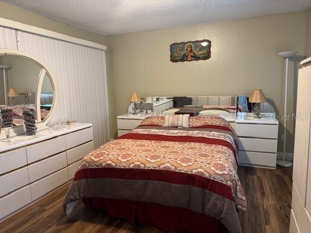 2457 Ravendale Court Kissimmee, FL 34758 - Photo 8 of 17 a bedroom with a bed and a table