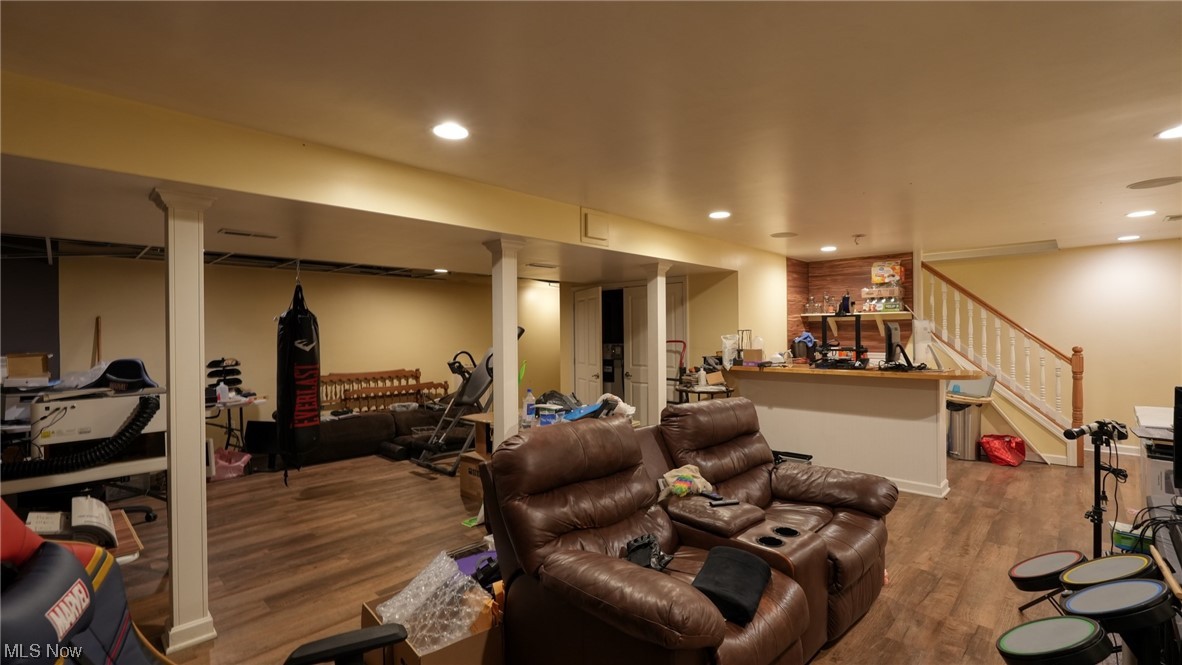 3752 Holmes Road Cambridge, OH 43725 - Photo 33 of 50 Living room featuring dark wood-type flooring and decorative columns