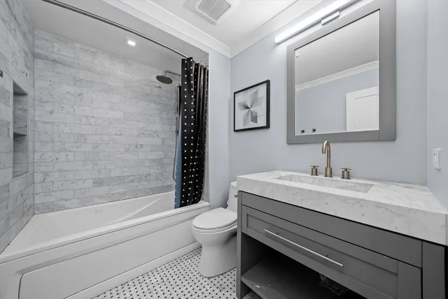 a bathroom with a sink a toilet and a bathtub