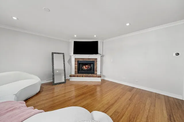 a living room with a couch and a fireplace