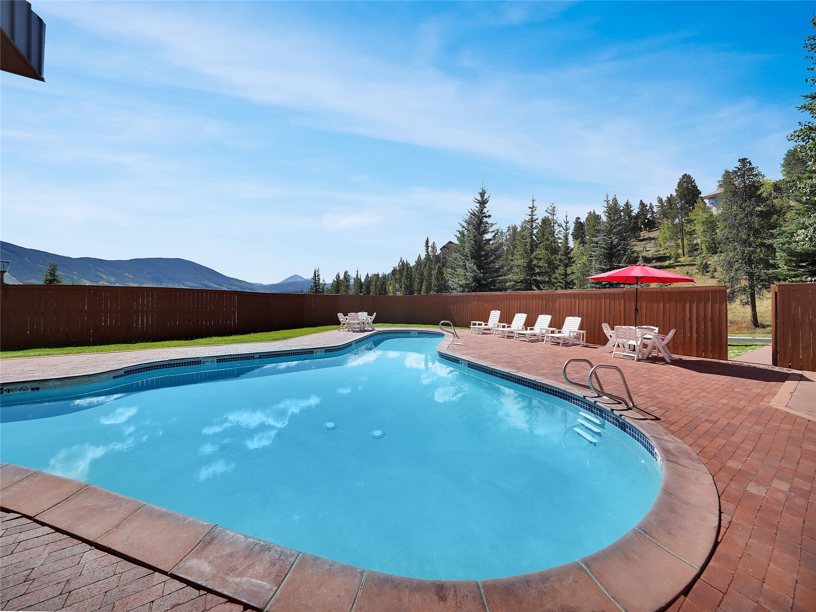 31 Pinnacle Lane Dillon, CO 80435 - Photo 48 of 50 a view of a swimming pool with a table and chairs