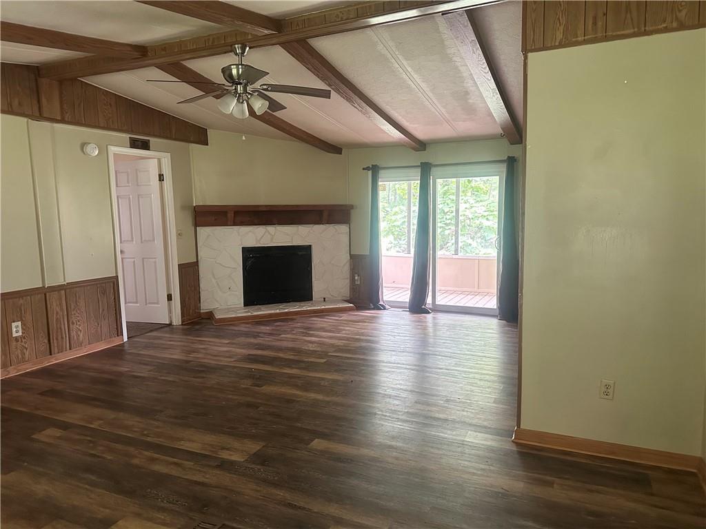 710 Seals Road Dallas, GA 30157 - Photo 2 of 7 a view of an empty room with wooden floor and a window