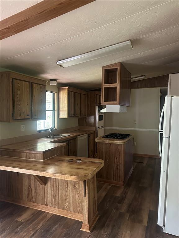 710 Seals Road Dallas, GA 30157 - Photo 4 of 7 a kitchen with kitchen island a large counter top and stainless steel appliances