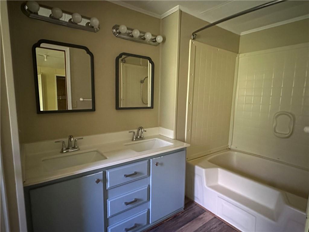 710 Seals Road Dallas, GA 30157 - Photo 5 of 7 a bathroom with a granite countertop sink a toilet and a mirror