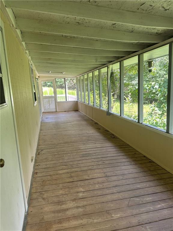 710 Seals Road Dallas, GA 30157 - Photo 6 of 7 a view of empty room with wooden floor and fan
