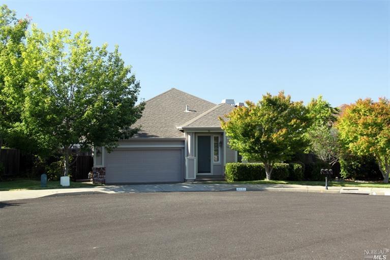 a view of a house with a yard and garage