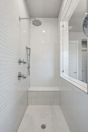 walk in closet with white walls