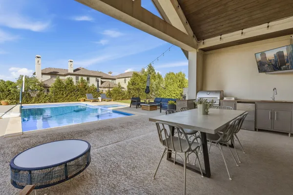 a outdoor living space with furniture and city view