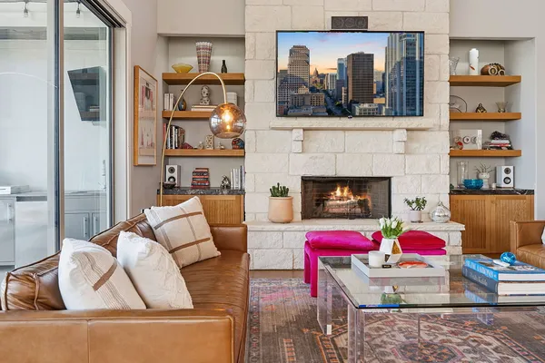 a living room with furniture and a fireplace