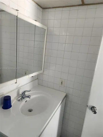 a view of a livingroom with furniture window and wooden floor