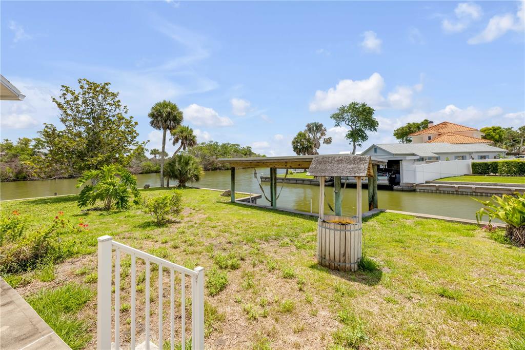 192 Azalea Road Edgewater, FL 32141 - Photo 65 of 94 a swimming pool with some trees in the background