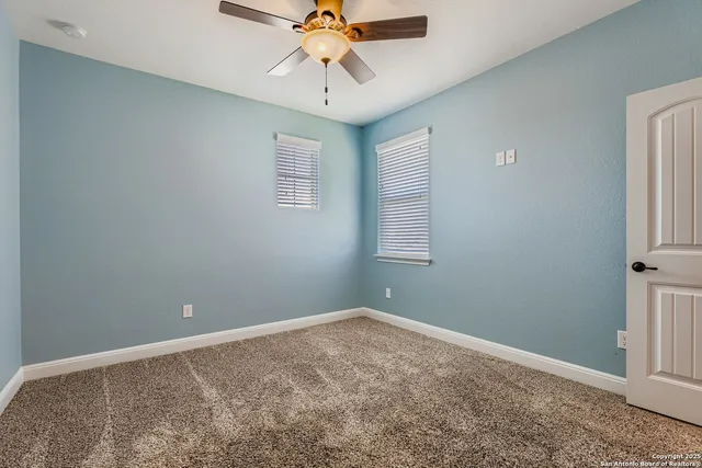 a view of a chandelier fan in a room