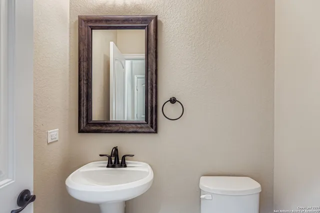 a view of empty room with wooden floor and closet